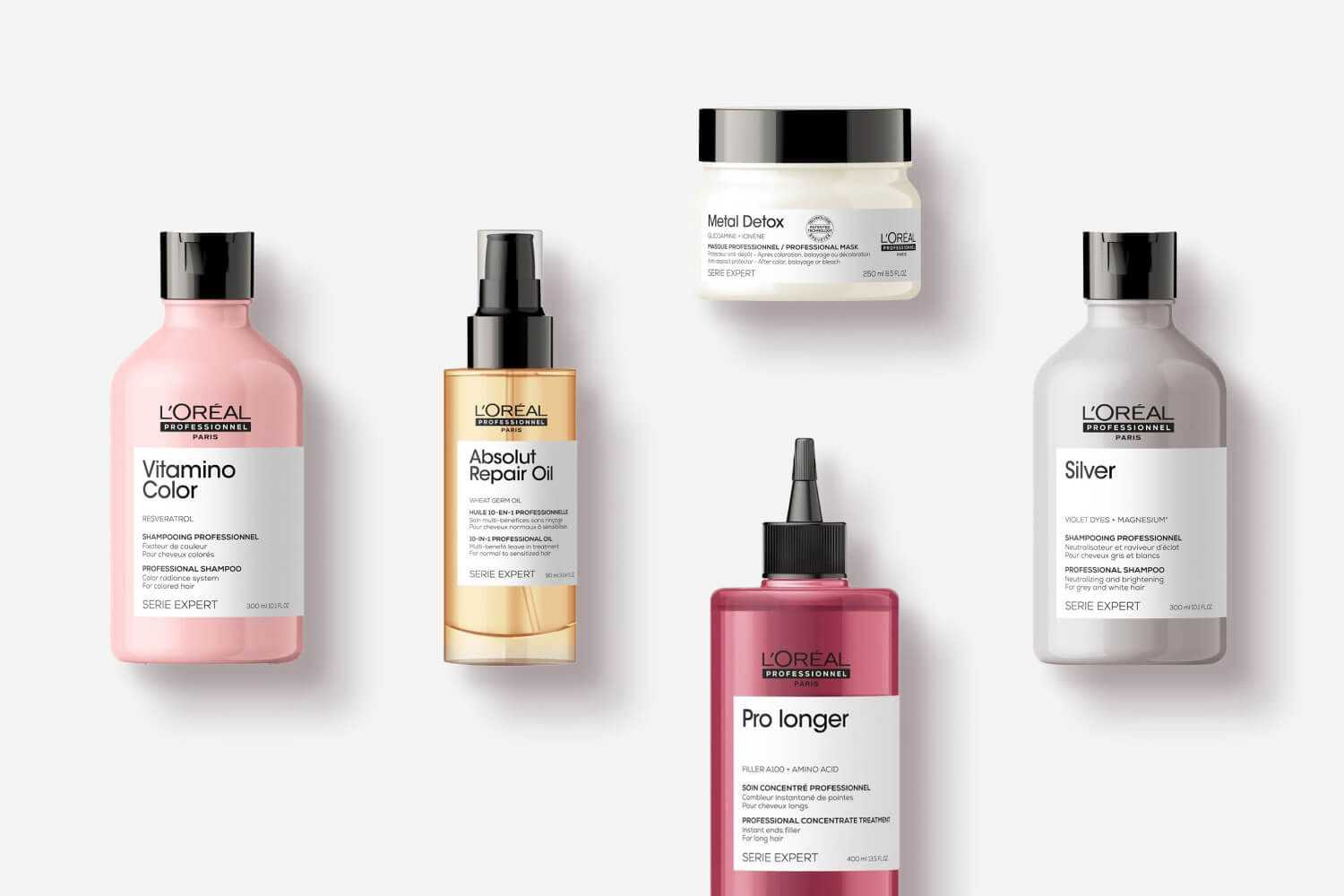 L'Oréal haircare products: shampoo, conditioner, oil, and hair mask on a white background.