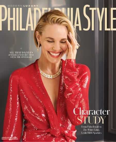 Woman in red dress smiling on Philadelphia Style magazine cover.