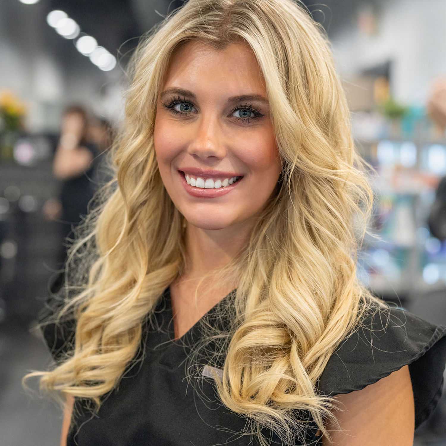 Portrait of Aleva, a professional stylist at Jason Matthew Salon, showcasing their expertise and style.