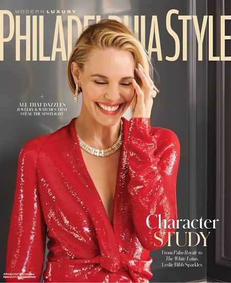 Woman in red dress smiling on Philadelphia Style magazine cover.