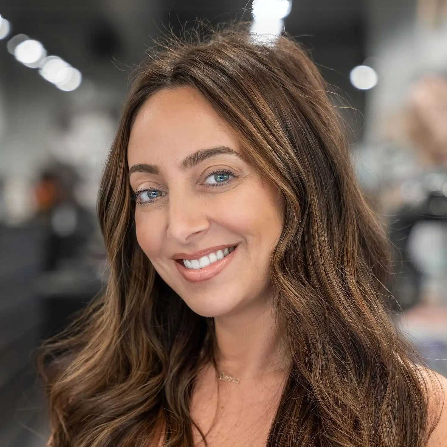 Portrait of Jessica Carfagno, a professional stylist at Jason Matthew Salon, showcasing their expertise and style.