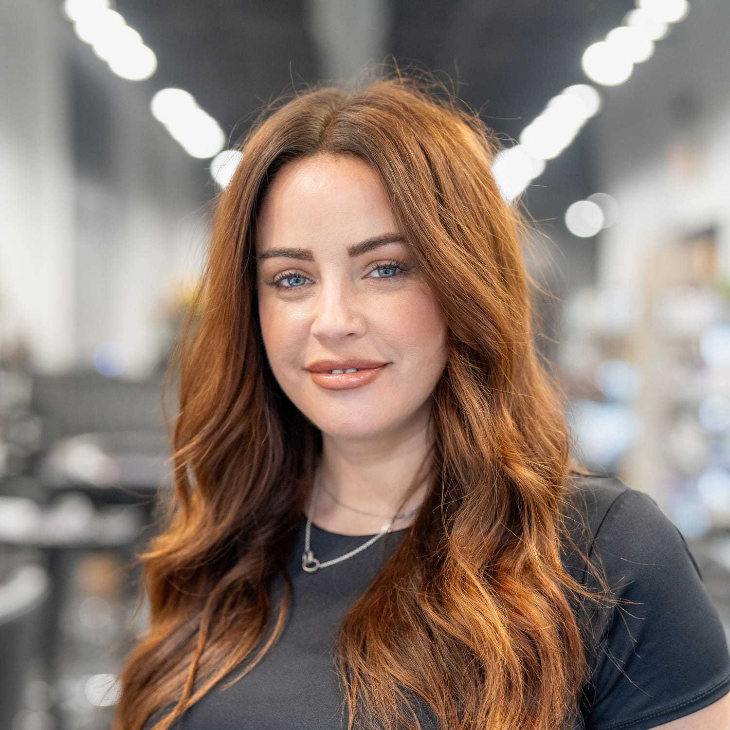 Portrait of Jill Snyder, a professional stylist at Jason Matthew Salon, showcasing their expertise and style.