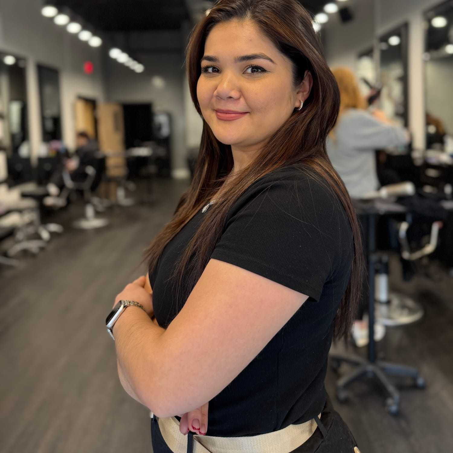 Portrait of Amira Davronova, a professional stylist at Jason Matthew Salon, showcasing their expertise and style.