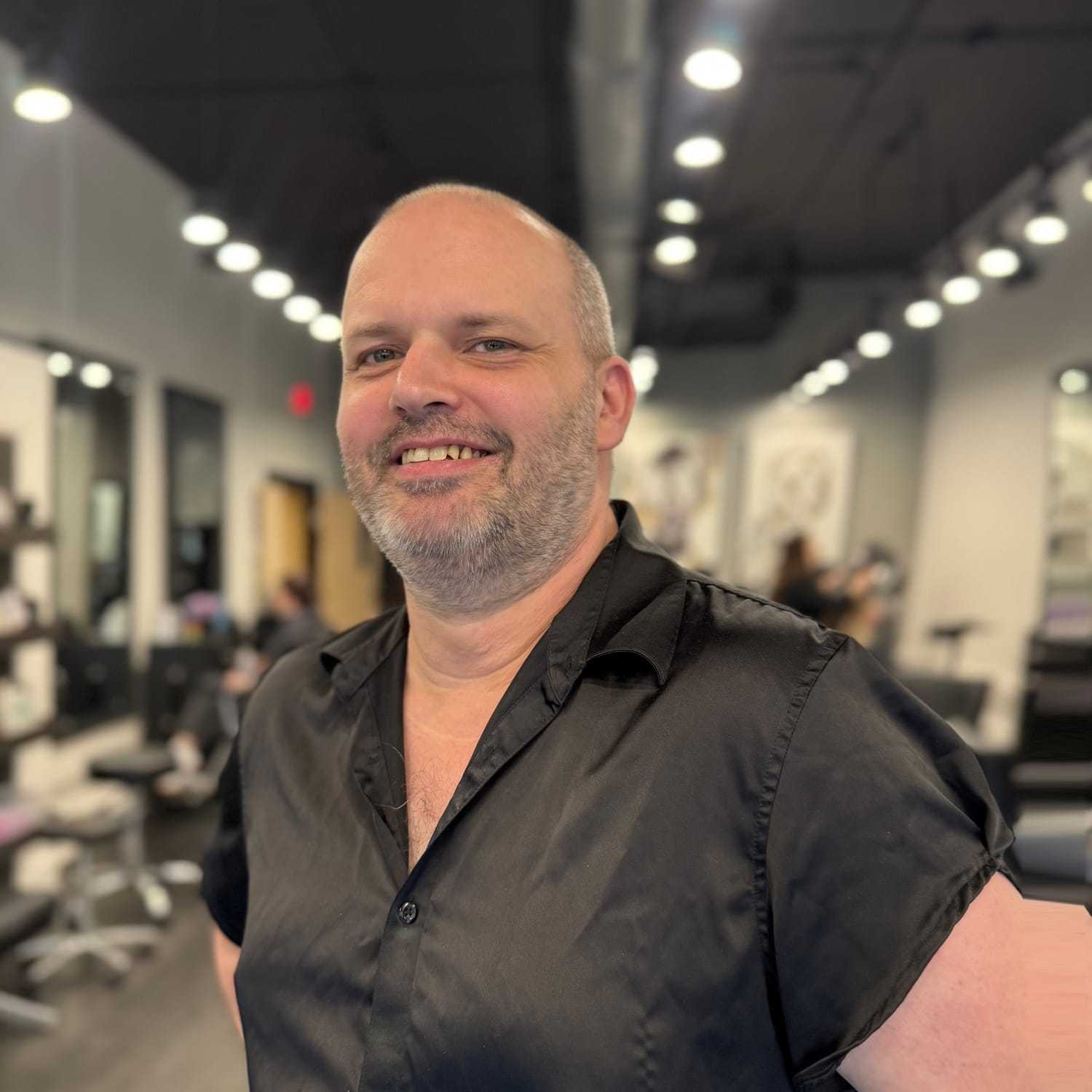 Portrait of Rich Forbes, a professional stylist at Jason Matthew Salon, showcasing their expertise and style.
