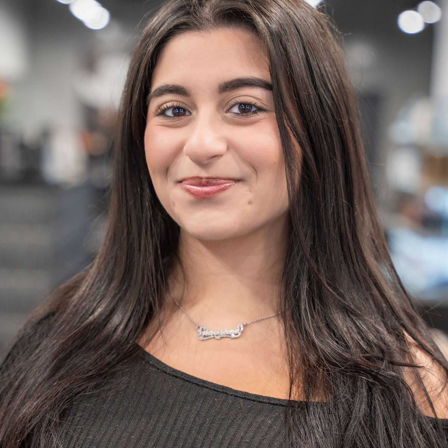 Portrait of Giovanna, a professional stylist at Jason Matthew Salon, showcasing their expertise and style.