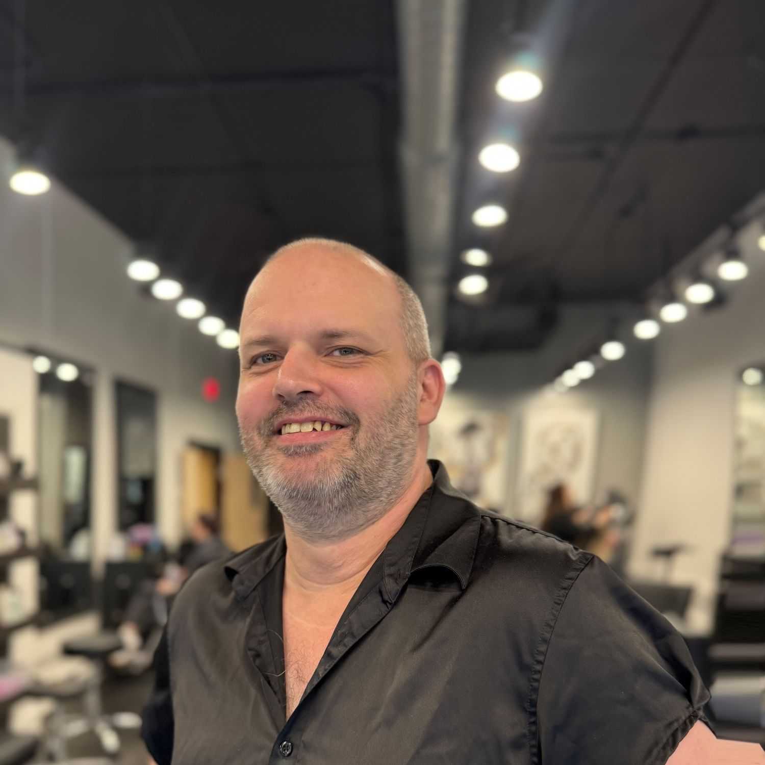Portrait of Rich Forbes, a professional stylist at Jason Matthew Salon, showcasing their expertise and style.