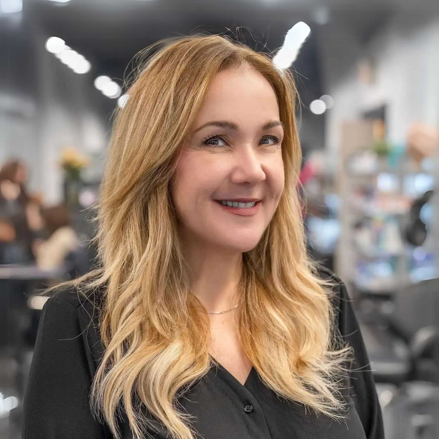 Portrait of Joyce Miele, a professional stylist at Jason Matthew Salon, showcasing their expertise and style.