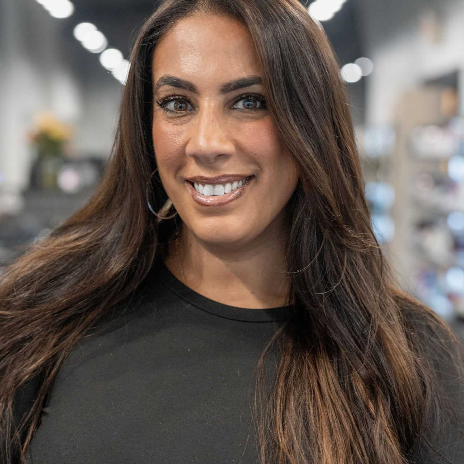 Portrait of Natalie Stracciolini, a professional stylist at Jason Matthew Salon, showcasing their expertise and style.