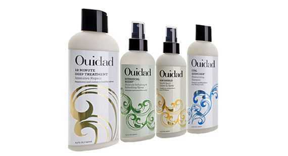 Four Ouidad hair care products, including treatments and stylers, displayed in bottles.