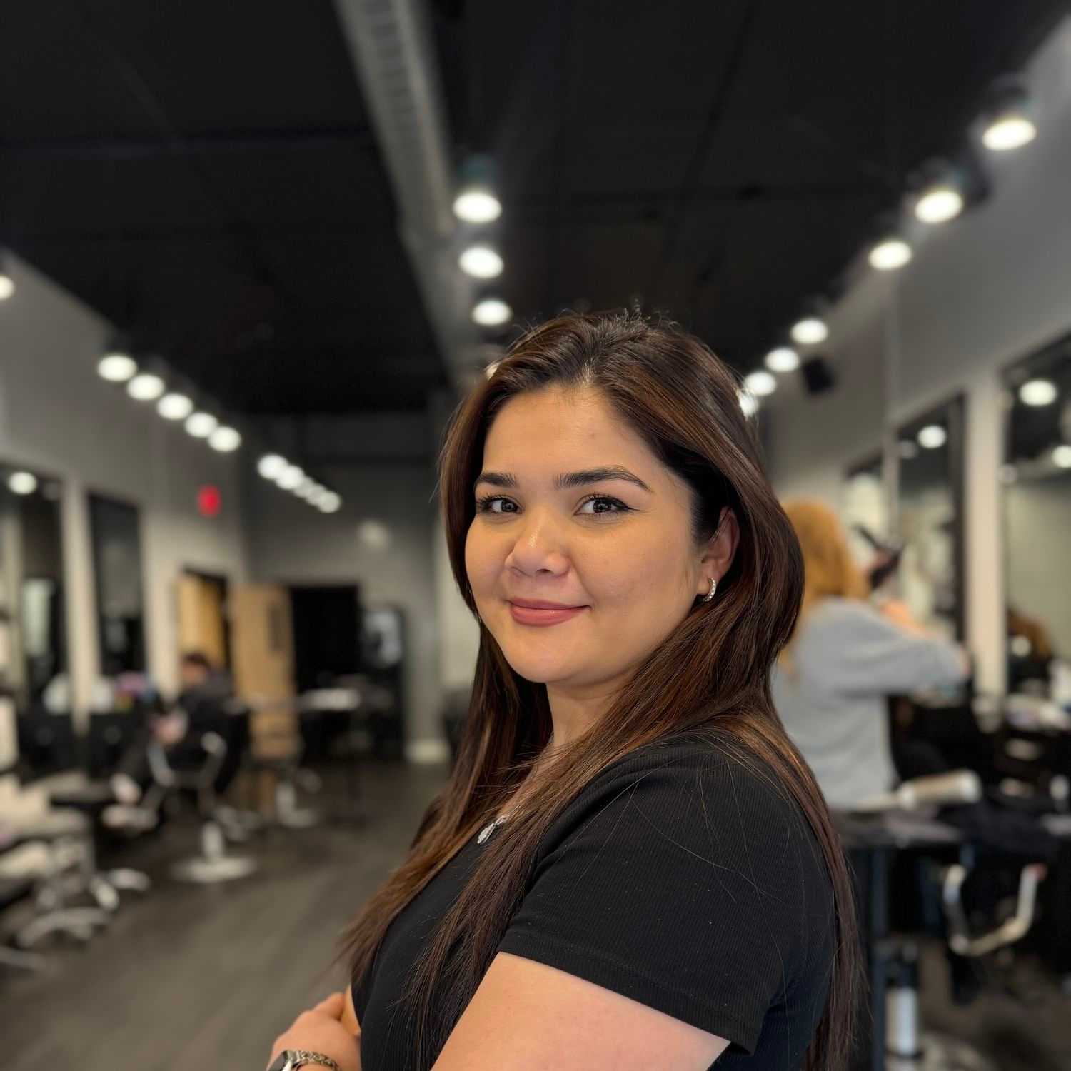 Portrait of Amira Davronova, a professional stylist at Jason Matthew Salon, showcasing their expertise and style.