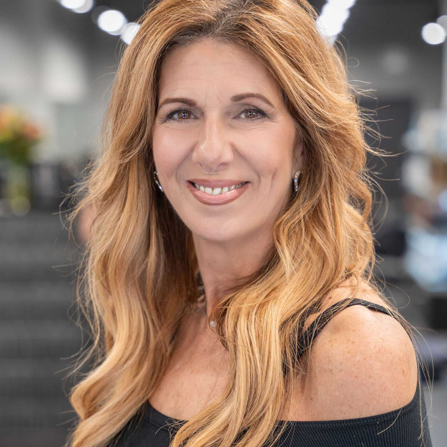 Portrait of Meg Smith, a professional stylist at Jason Matthew Salon, showcasing their expertise and style.