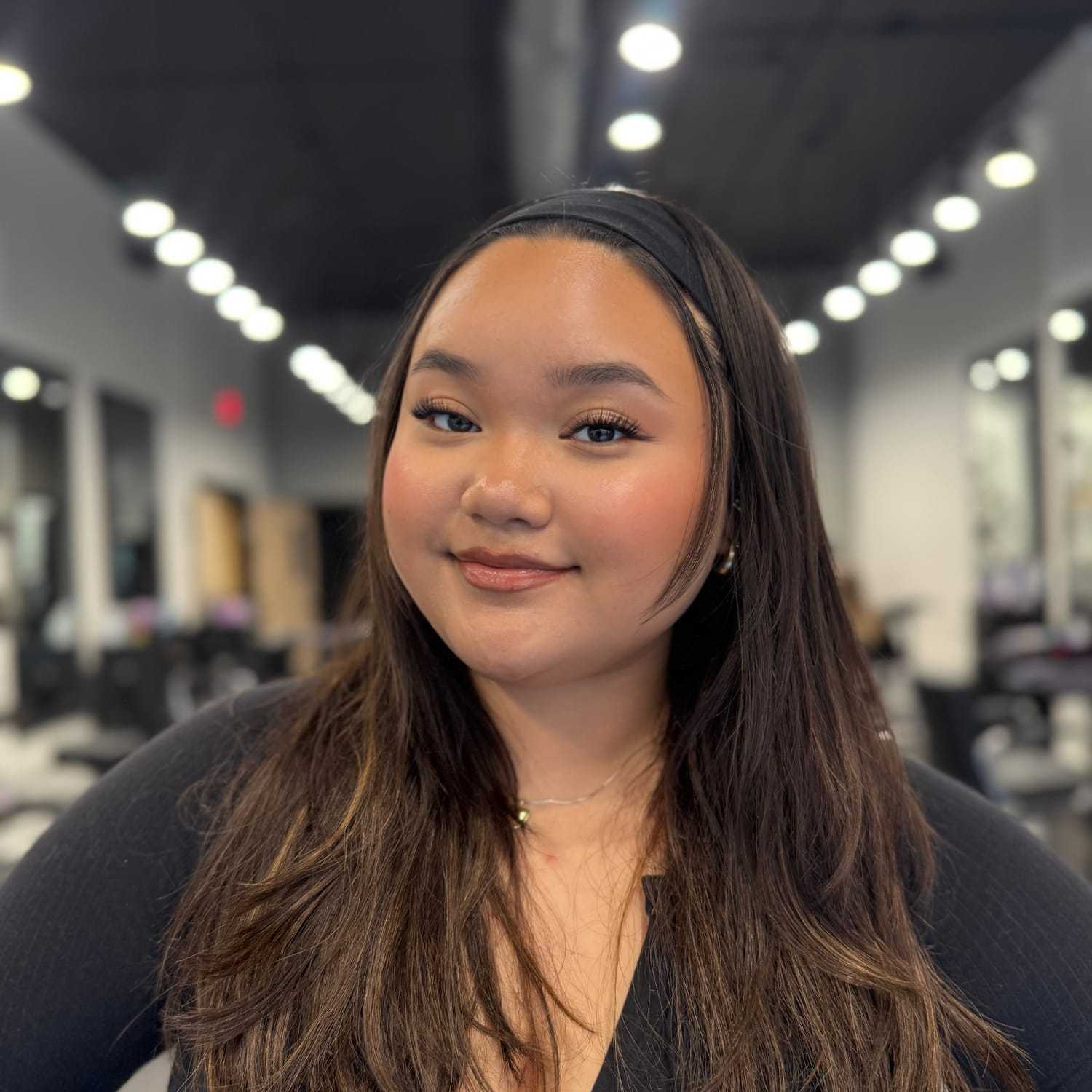 Portrait of Crystabelle Sidi, a professional stylist at Jason Matthew Salon, showcasing their expertise and style.