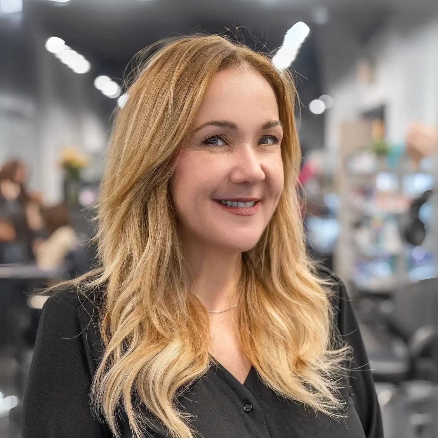 Portrait of Joyce Miele, a professional stylist at Jason Matthew Salon, showcasing their expertise and style.