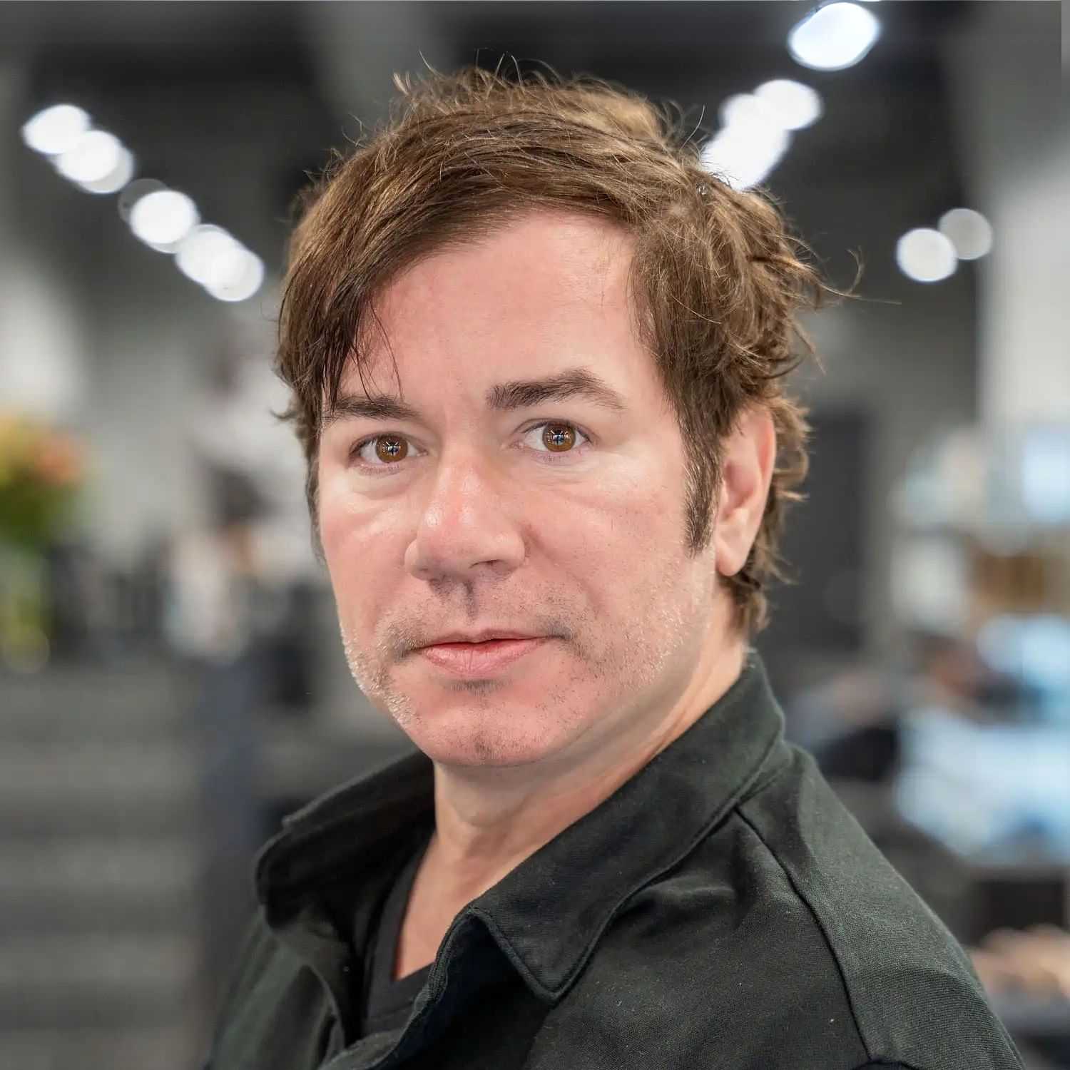 Portrait of Jimmy O’Donnell, a professional stylist at Jason Matthew Salon, showcasing their expertise and style.